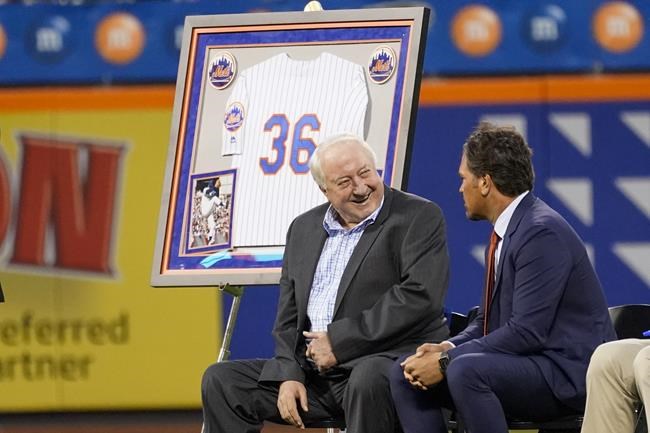 Former New York Mets pitcher Jerry Koosman, left, and former Mets catcher Mike Piazza talk during a ceremony Saturday, Aug. 28, 2021, at Citi Field in New York. The Mets retired Koosman's uniform No. 36 before their game against the Washington Nationals. (AP Photo/Mary Altaffer)