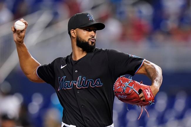 Miami Marlins' Sandy Alcantara delivers a pitch during the first inning of a baseball game against the Cincinnati Reds, Saturday, Aug. 28, 2021, in Miami. (AP Photo/Wilfredo Lee)