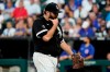 Chicago White Sox starting pitcher Lance Lynn wipes his face as he walks to the dugout during the fourth inning of a baseball game against the Chicago Cubs in Chicago, Saturday, Aug. 28, 2021. (AP Photo/Nam Y. Huh)