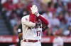 Los Angeles Angels' Shohei Ohtani, of Japan, holds his wrist after he struck out during the first inning of the team's baseball game against the San Diego Padres in Anaheim, Calif., Saturday, Aug. 28, 2021. (AP Photo/Jae C. Hong)