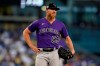 Colorado Rockies starter Jon Gray reacts after throwing a pitch during the third inning of a baseball game against the Los Angeles Dodgers, Saturday, Aug. 28, 2021, in Los Angeles. (AP Photo/Marcio Jose Sanchez)