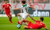 Moenchengladbach's Jonas Hofmann, left, and Berlin's Christopher Trimmel fight for the ball during the German Bundesliga soccer match between FC Union Berlin and Borussia Moenchengladbach at the Stadion An der Alten Foersterei in Berlin, Saturday, Aug. 29, 2021. (Andreas Gora/dpa via AP)