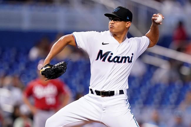 Miami Marlins starting pitcher Jesus Luzardo throws during the first inning of a baseball game against the Cincinnati Reds, Sunday, Aug. 29, 2021, in Miami. (AP Photo/Lynne Sladky)