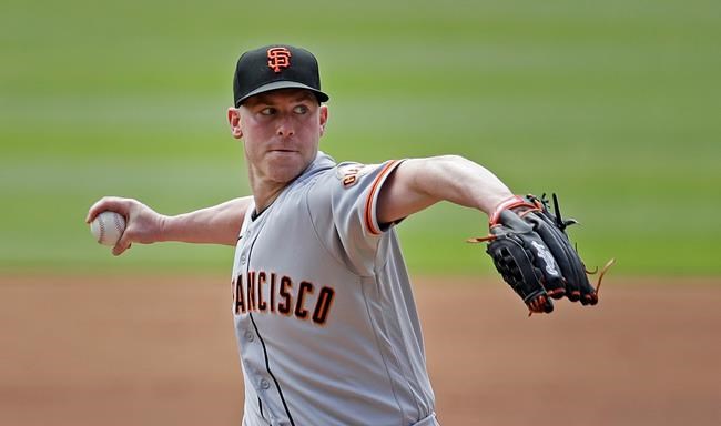 San Francisco Giants pitcher Anthony DeSclafani works against the Atlanta Braves in the first inning of a baseball game Sunday, Aug. 29, 2021, in Atlanta. (AP Photo/Ben Margot)