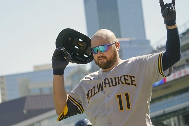 Milwaukee Brewers' Rowdy Tellez celebrates his three-run home run off Minnesota Twins pitcher Griffin Jax after scoring in the third inning of a baseball game, Sunday, Aug. 29, 2021, in Minneapolis. (AP Photo/Jim Mone)