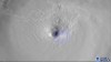 This satellite image provided by the National Oceanic and Atmospheric Administration and captured by NOAA's GOES-16 shows lightning swirling around the eye of Hurricane Ida as the storm approaches the Louisiana coast, Sunday morning, Aug. 29, 2021. (NOAA via AP)