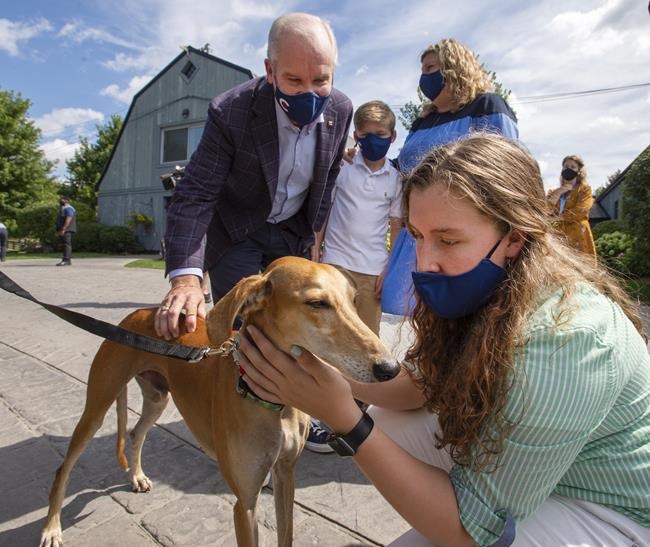 Conservative Leader Erin OToole, his daughter Mollie, right, son, Jack and his wife Rebecca, visit an animal shelter while campaigning Monday, August 30, 2021 in King City, Ontario. Canadians will vote in a federal election Sept. 20th. THE CANADIAN PRESS/Ryan Remiorz
