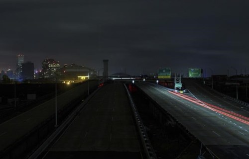 A lone car heads west on the Pontchartrain Expressway Monday, Aug. 30, 2021 after New Orleans lost power during Hurricane Ida. (David Grunfeld/The Advocate via AP)