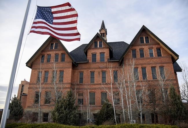 FILE - In this April 2, 2021, file photo, a U.S. flag flies in front of Montana Hall at Montana State University in Bozeman, Mont. The university said Monday, Aug. 30 that the founders of an insurance company are donating $101 million to its nursing school. School officials said the donation is the largest gift to a university nursing program in U.S. history and will help the state deal with a shortage of nurses. (Rachel Leathe/Bozeman Daily Chronicle via AP, File)