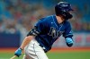 Tampa Bay Rays' Austin Meadows head for first base after his RBI single off Boston Red Sox starting pitcher Nick Pivetta during the third inning of a baseball game Monday, Aug. 30, 2021, in St. Petersburg, Fla. Rays' Brandon Lowe scored on the play. (AP Photo/Chris O'Meara)