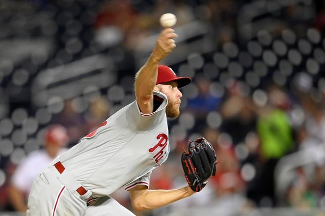 Philadelphia Phillies starting pitcher Zack Wheeler delivers a pitch during the third inning of a baseball game against the Washington Nationals, Monday, Aug. 30, 2021, in Washington. (AP Photo/Nick Wass)
