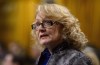 Liberal MP Karen McCrimmon stands during question period in the House of Commons on Parliament Hill in Ottawa on Monday, Oct. 22, 2018. McCrimmon isn't seeking re-election in a west-Ottawa riding. THE CANADIAN PRESS/Sean Kilpatrick