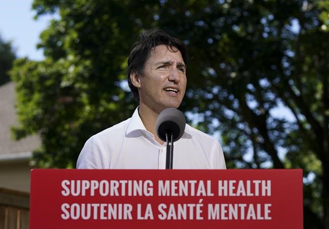 Liberal Leader Justin Trudeau announces mental health funding at campaign stop in a backyard during the Canadian federal election in Kanata, Ont., on Tuesday, August 31, 2021. THE CANADIAN PRESS/Nathan Denette