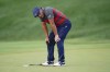 Bryson DeChambeau reacts after missing a putt on the 17th green, the third playoff hole against Patrick Cantlay during the final round of the BMW Championship golf tournament, Sunday, Aug. 29, 2021, at Caves Valley Golf Club in Owings Mills, Md. (AP Photo/Julio Cortez)