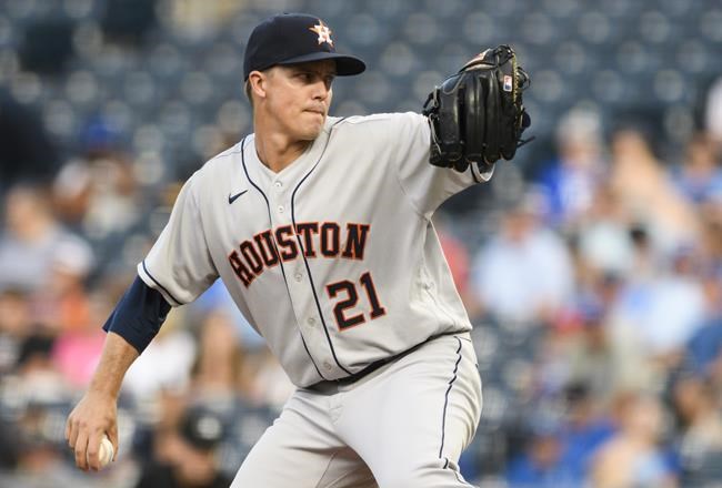 Houston Astros starting pitcher Zack Greinke throws to a Kansas City Royals batter during the first inning of a baseball game Wednesday, Aug. 18, 2021, in Kansas City, Mo. (AP Photo/Reed Hoffmann)