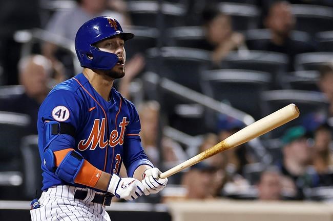 New York Mets' Michael Conforto watches his two-run home run against the Miami Marlins during the fourth inning of the second baseball game of a doubleheader Tuesday, Aug. 31, 2021, in New York. (AP Photo/Adam Hunger)