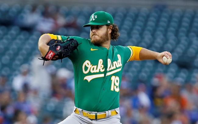Oakland Athletics starting pitcher Cole Irvin (19) delivers against the Detroit Tigers during the first inning of a baseball game Tuesday, Aug. 31, 2021, in Detroit. (AP Photo/Duane Burleson)