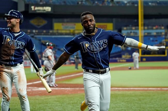 Tampa Bay Rays' Randy Arozarena celebrates after scoring on an RBI double by Yandy Diaz off Boston Red Sox pitcher Stephen Gonsalves during the third inning of a baseball game Tuesday, Aug. 31, 2021, in St. Petersburg, Fla. (AP Photo/Chris O'Meara)