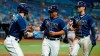 Tampa Bay Rays' Francisco Mejia, center, and Kevin Kiermaier, right, celebrate with Austin Meadows after Mejia and Kiermaier scored on an RBI single by Wander Franco off Boston Red Sox pitcher Brad Peacock during the third inning of a baseball game Tuesday, Aug. 31, 2021, in St. Petersburg, Fla. (AP Photo/Chris O'Meara)