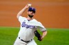 Texas Rangers starting pitcher Jordan Lyles throws during the first inning of the team's baseball game against the Colorado Rockies in Arlington, Texas, Tuesday, Aug. 31, 2021. (AP Photo/Tony Gutierrez)
