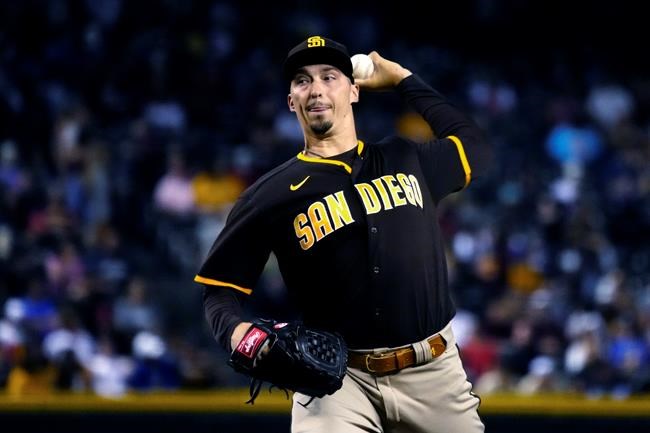 San Diego Padres pitcher Blake Snell throws to an Arizona Diamondbacks batter during the first inning of a baseball game Tuesday, Aug. 31, 2021, in Phoenix. (AP Photo/Rick Scuteri)