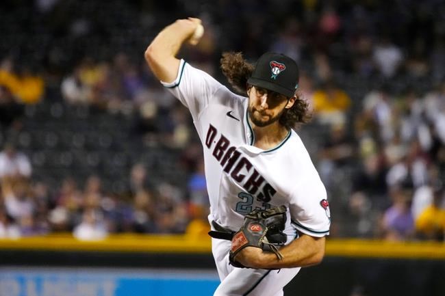 Arizona Diamondbacks pitcher Zac Gallen throws to a San Diego Padres batter during the first inning of a baseball game Tuesday, Aug. 31, 2021, in Phoenix. (AP Photo/Rick Scuteri)