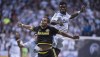 Vancouver Whitecaps' Sam Adekugbe, right, flights for control of the ball with Columbus Crew SC Ben Speas during the first half of MLS soccer action in Vancouver, B.C. Wednesday, April, 8, 2015.&nbsp; THE CANADIAN PRESS/Jonathan Hayward