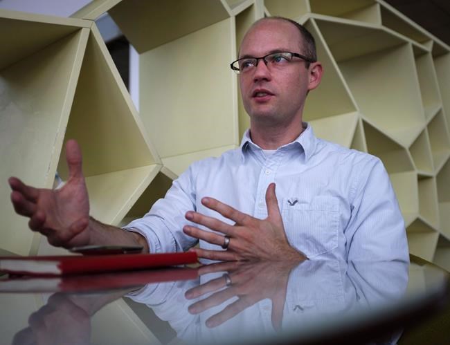 Economist Trevor Tombe speaks during an interview at the University of Calgary in Calgary, Alta., Thursday, Nov. 23, 2017. THE CANADIAN PRESS/Jeff McIntosh