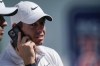 Rory McIlroy, of Northern Ireland, talks on a mobile phone on the first tee during practice at the Tour Championship golf tournament on Wednesday, Sept. 1, 2021, at East Lake Golf Club in Atlanta. (AP Photo/Brynn Anderson)