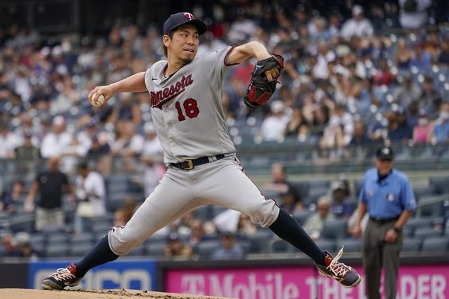 Minnesota Twins pitcher Kenta Maeda delivers against the New York Yankees in the first inning of a baseball game, Saturday, Aug. 21, 2021, in New York. (AP Photo/Mary Altaffer)