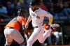 Seattle Mariners' J.P. Crawford, right, scores as Houston Astros catcher Martin Maldonado waits for the throw during the sixth inning of a baseball game Wednesday, Sept. 1, 2021, in Seattle. (AP Photo/Elaine Thompson)