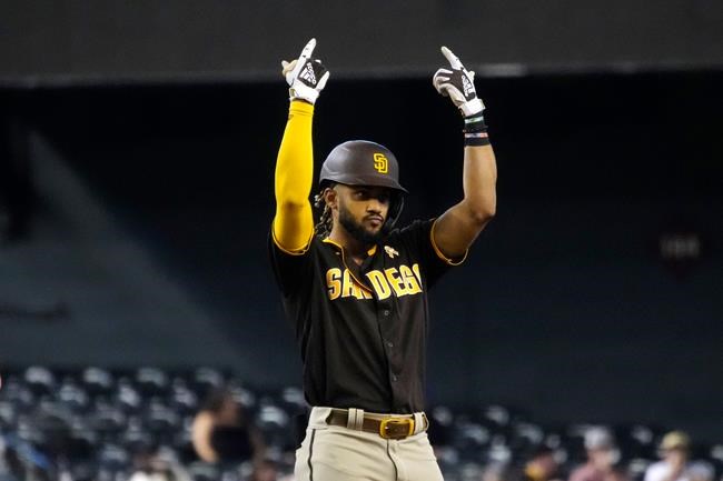 San Diego Padres' Fernando Tatis Jr. reacts after hitting a double against the Arizona Diamondbacks during the seventh inning of a baseball game Wednesday, Sept. 1, 2021, in Phoenix. (AP Photo/Rick Scuteri)