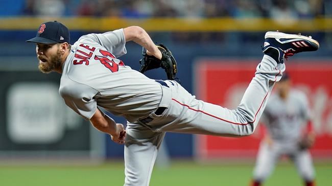 Boston Red Sox starting pitcher Chris Sale follows through on a delivery to the Tampa Bay Rays during the first inning of a baseball game Wednesday, Sept. 1, 2021, in St. Petersburg, Fla. (AP Photo/Chris O'Meara)