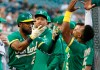 Oakland Athletics' Starling Marte (2) celebrates with Tony Kemp (5) after hitting a solo home run against the Detroit Tigers during the fourth inning of a baseball game Wednesday, Sept. 1, 2021, in Detroit. (AP Photo/Duane Burleson)