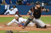 Toronto Blue Jays' Bo Bichette, left, slides safely into home ahead of a tag by Baltimore Orioles catcher Austin Wynns on a single by Blue Jays' Teoscar Hernandez in the fourth inning of an American League baseball game in Toronto on Wednesday, Sept. 1, 2021. THE CANADIAN PRESS/Jon Blacker