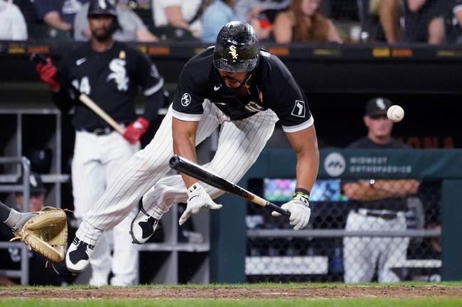 Chicago White Sox's Jose Abreu is hit by a pitch from Pittsburgh Pirates' Anthony Banda during the sixth inning of a baseball game Wednesday, Sept. 1, 2021, in Chicago. (AP Photo/Charles Rex Arbogast)