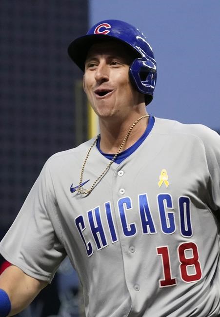Chicago Cubs' Frank Schwindel smiles as he heads to the dugout after his three-run home run off Minnesota Twins pitcher Joe Ryan during the third inning of a baseball game, Wednesday, Sept. 1, 2021, in Minneapolis. (AP Photo/Jim Mone)