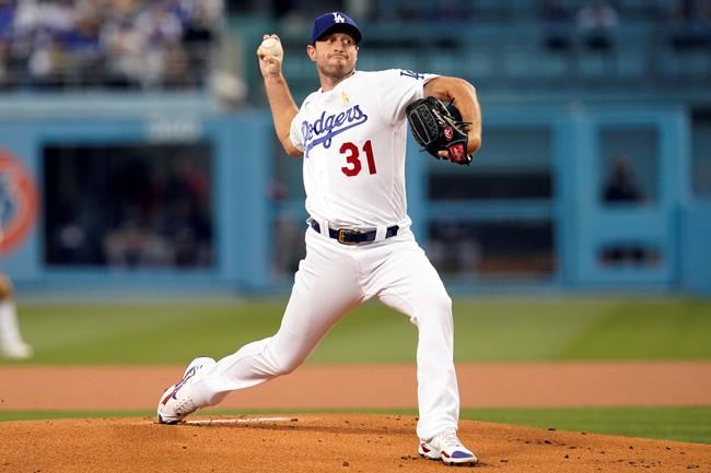 Los Angeles Dodgers starting pitcher Max Scherzer throws to an Atlanta Braves batter during the first inning of a baseball game Wednesday, Sept. 1, 2021, in Los Angeles. (AP Photo/Marcio Jose Sanchez)