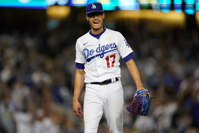 Los Angeles Dodgers relief pitcher Joe Kelly reacts after getting Atlanta Braves' Adam Duvall to ground out to end the baseball game Wednesday, Sept. 1, 2021, in Los Angeles. (AP Photo/Marcio Jose Sanchez)