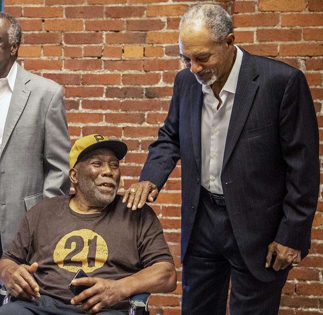 Manny Sanguillen, left, and Dave Cash talk during an event hosted by the Pittsburgh Pirates to honor the 50th anniversary of the first all-minority lineup to take the field in Major League Baseball history, at the Heinz History Center, Wednesday, Sept. 1, 2021, in Pittsburgh. (Alexandra Wimley/Pittsburgh Post-Gazette via AP)