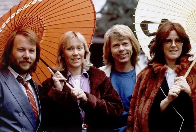 FILE - Members of the pop group ABBA, from left, Benny Andersson, Agnetha Foltskog, Bjorn Ulvaeus and Anni-Frid Lyngstad, appear in Tokyo on March 14, 1980. ABBA is releasing its first new music in four decades, along with a concert performance that will see the “Dancing Queen” quartet going entirely digital. The forthcoming album “Voyage,