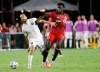 Toronto FC midfielder Noble Okello (14) and Inter Miami midfielder Rodolfo Pizarro (10) fight for the ball during the second half of an MLS soccer match Saturday, Aug. 21, 2021, in Fort Lauderdale, Fla.&nbsp; THE CANADIAN PRESS/AP -Rhona Wise