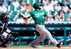 Oakland Athletics' Jed Lowrie (8) watches his three-run home run against the Detroit Tigers during the first inning of a baseball game Thursday, Sept. 2, 2021, in Detroit. (AP Photo/Duane Burleson)