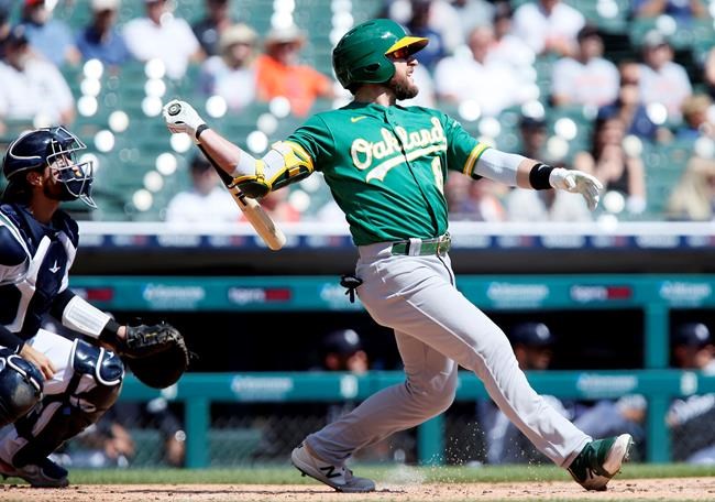 Oakland Athletics' Jed Lowrie (8) watches his three-run home run against the Detroit Tigers during the first inning of a baseball game Thursday, Sept. 2, 2021, in Detroit. (AP Photo/Duane Burleson)