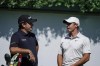 Patrick Reed, left, and Rory McIlroy, right, talk on the first tee during practice at the Tour Championship golf tournament on Wednesday, Sept. 1, 2021, at East Lake Golf Club in Atlanta. (AP Photo/Brynn Anderson)