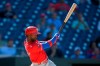 Philadelphia Phillies' Andrew McCutchen follows through with an RBI single during the eighth inning of a baseball game against the Washington Nationals, Thursday, Sept. 2, 2021, in Washington. Phillies' J.T. Realmuto scored on the play. The Phillies won 7-6. (AP Photo/Nick Wass)