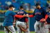 Boston Red Sox manager Alex Cora, left, takes the ball from starting pitcher Eduardo Rodriguez as he is taken out of the game against the Tampa Bay Rays during the seventh inning of a baseball game Thursday, Sept. 2, 2021, in St. Petersburg, Fla. (AP Photo/Chris O'Meara)