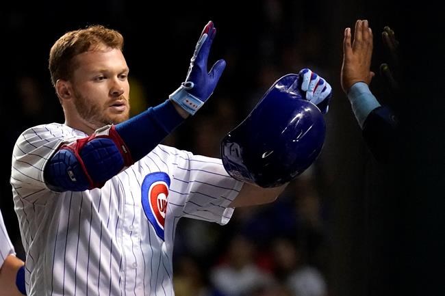 Chicago Cubs' Ian Happ celebrates with teammates after hitting a two-run home run during the seventh inning of a baseball game against the Pittsburgh Pirates in Chicago, Thursday, Sept. 2, 2021. (AP Photo/Nam Y. Huh)