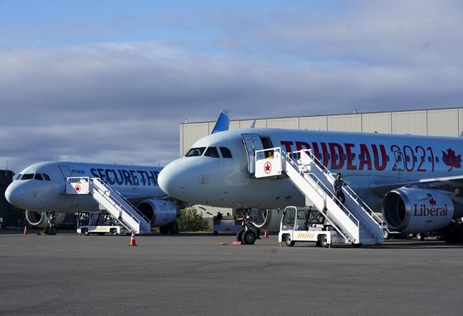 Liberal Leader Justin Trudeau's campaign plane sits on the tarmac next with Conservative Leader Erin O'Toole's plane during the Canadian federal election campaign in Montreal, Que., on Friday, September 3, 2021. THE CANADIAN PRESS/Nathan Denette