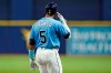 Tampa Bay Rays' Wander Franco points to his head after he drew a walk from Boston Red Sox starting pitcher Eduardo Rodriguez during the seventh inning of a baseball game Thursday, Sept. 2, 2021, in St. Petersburg, Fla. Franco left the game after injuring himself on a swing. (AP Photo/Chris O'Meara)